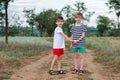 Two little brothers walking in countryside