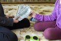 Two little children boy and girl playing with dollars money. Royalty Free Stock Photo