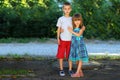 Two little children brother and sister together. Girl in dress h Royalty Free Stock Photo