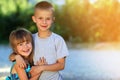 Two little children brother and sister together. Girl in dress h Royalty Free Stock Photo