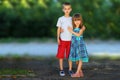 Two little children brother and sister together. Girl in dress h Royalty Free Stock Photo