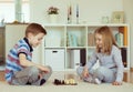 Two little children playing chess at home Royalty Free Stock Photo