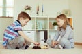 Two little children playing chess at home Royalty Free Stock Photo