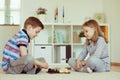 Two little children playing chess at home Royalty Free Stock Photo