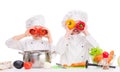 Two little cooks playing vegetables for soup Royalty Free Stock Photo