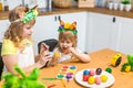 Two little cute girls painting on Easter eggs Royalty Free Stock Photo