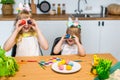 Two little cute sisters painting on Easter eggs Royalty Free Stock Photo