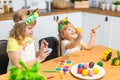 Two little cute girls painting on Easter eggs Royalty Free Stock Photo