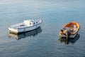 Two little fishing boats floating on the Mediterranean sea shore. Italy Royalty Free Stock Photo