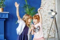 Two little funny children dance and sing a song in karaoke. The Royalty Free Stock Photo