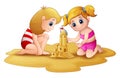 Two little girl making sandcastle at beach Royalty Free Stock Photo