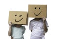 Two little girl wearing cardboard box on his head with smiley face Royalty Free Stock Photo