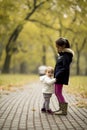 Two little girls at autumn park Royalty Free Stock Photo