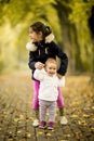 Two little girls at autumn park Royalty Free Stock Photo