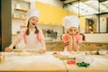 Two little girls chefs are laughing at each other Royalty Free Stock Photo