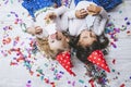 Two little girls child fashion colorful confetti on the floor an Royalty Free Stock Photo