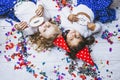 Two little girls child fashion colorful confetti on the floor an Royalty Free Stock Photo