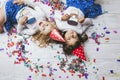 Two little girls child fashion colorful confetti on the floor an Royalty Free Stock Photo