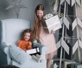 Two little girls with Christmas presents on Christmas eve Royalty Free Stock Photo