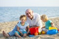 Two little girls with dad at sea Royalty Free Stock Photo