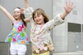 Two little girls dancing in the city Royalty Free Stock Photo