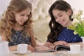 Two little girls drinking tea Royalty Free Stock Photo