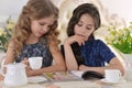 Two little girls drinking tea Royalty Free Stock Photo