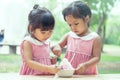 Two little girls eat ice cream together Royalty Free Stock Photo