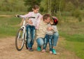 Two little girls with father embracing outside