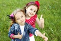 Two little girls friends. Thumbs up Royalty Free Stock Photo
