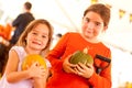 Two Little Girls Holding Their Pumpkins At A Pumpkin Patch Royalty Free Stock Photo