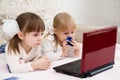 Two little girls are with a laptop Royalty Free Stock Photo