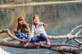 Two little girls laughing and pointing fingers on Lake Biograd (