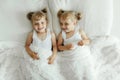 Two Little Girls Laying on a Bed Together Royalty Free Stock Photo