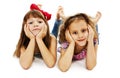 Two little girls are lying on the floor Royalty Free Stock Photo