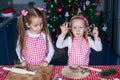 Two little girls make gingerbread cookies for Christmas Royalty Free Stock Photo