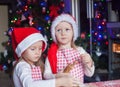 Two little girls make gingerbread cookies for Royalty Free Stock Photo