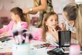 Two little girls in a make-up studio.