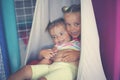 Two little girls playing in playground. Little sisters playing t Royalty Free Stock Photo