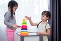 Two little girls playing small toy balls in home together. Education and Happiness lifestyle concept. Funny learning and Children Royalty Free Stock Photo