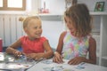 Two little girls playing together in playground. Two sisters the Royalty Free Stock Photo