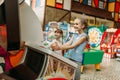 Two little girls plays on video game machine Royalty Free Stock Photo