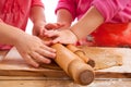 Two little girls with rolling pins baking Royalty Free Stock Photo