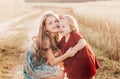 Two little girls sisters play in a wheat field Royalty Free Stock Photo