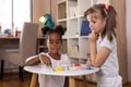 Girls playing ludo board game