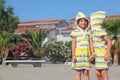 Two little girls standing on beach