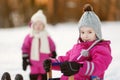 Two little girls at sunset at winter Royalty Free Stock Photo