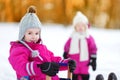 Two little girls at sunset on a winter day Royalty Free Stock Photo