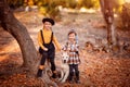 Girls walking Golden Retriever in autumn Park. Royalty Free Stock Photo