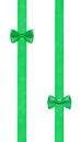 Two little green bow knots on two parallel ribbons Royalty Free Stock Photo